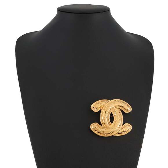 CHANEL Gold Logo Brooch